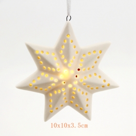 estrella de cerámica del árbol de navidad que cuelga la luz llevada
