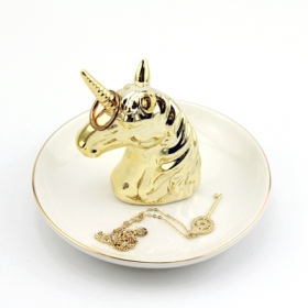 unicornio de cerámica platos de oro y base blanca
