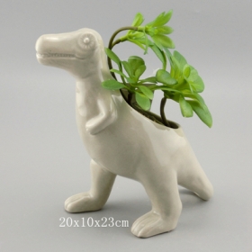 maceta suculenta cerámica t-rex con plantas artificiales